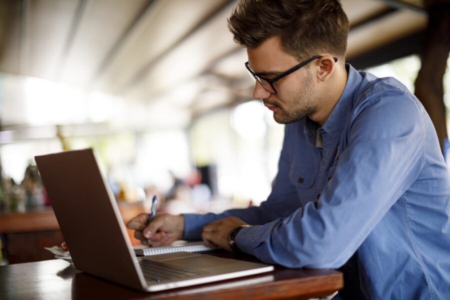 Young man working at a cafe