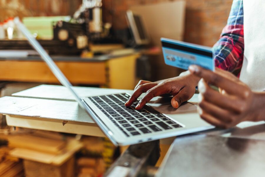 A person using their credit card, looking up the grace period