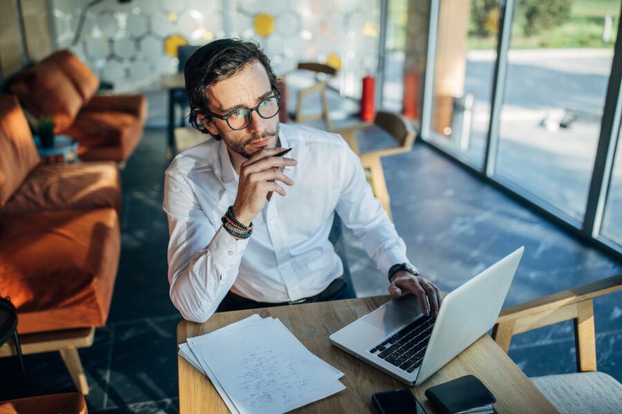 A freelancer businessman working on laptop in cafe