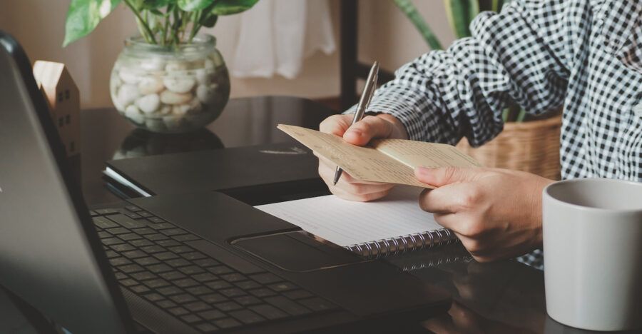 Person balancing their checkbook at home