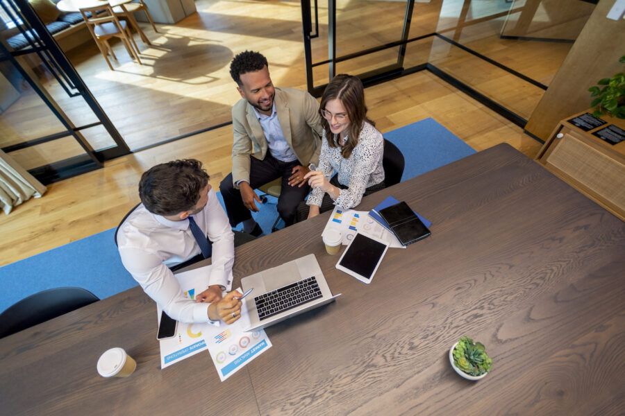 Bank employees taking at a table