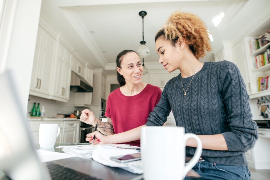 A couple making financial plans, working at home from their kitchen.