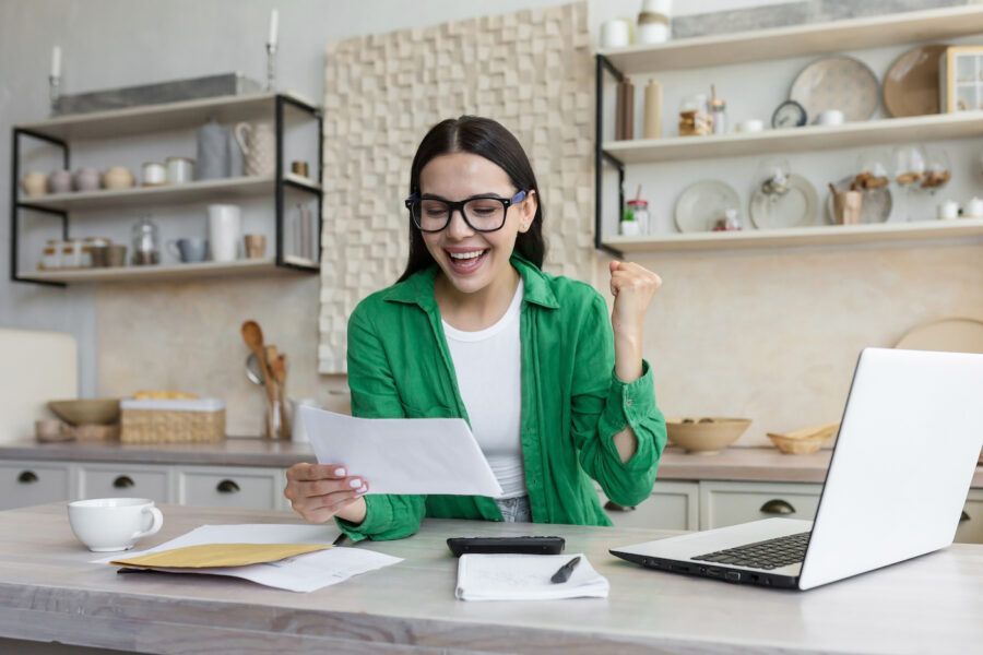 Young woman receiving good financial news.